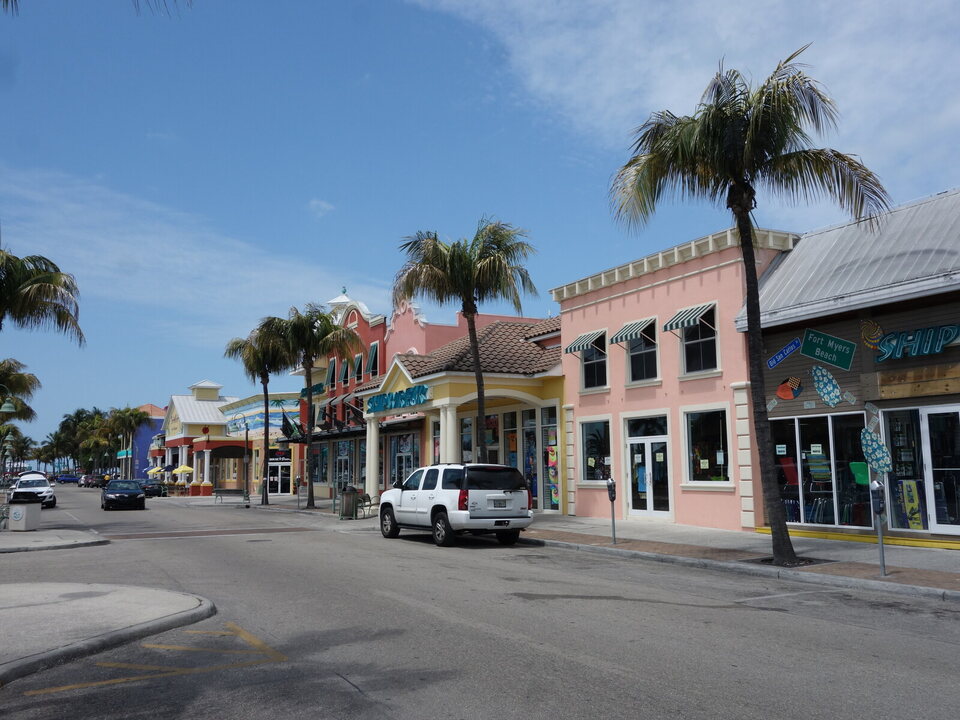 Colorful storefronts and palm trees in historic downtown Fort Myers