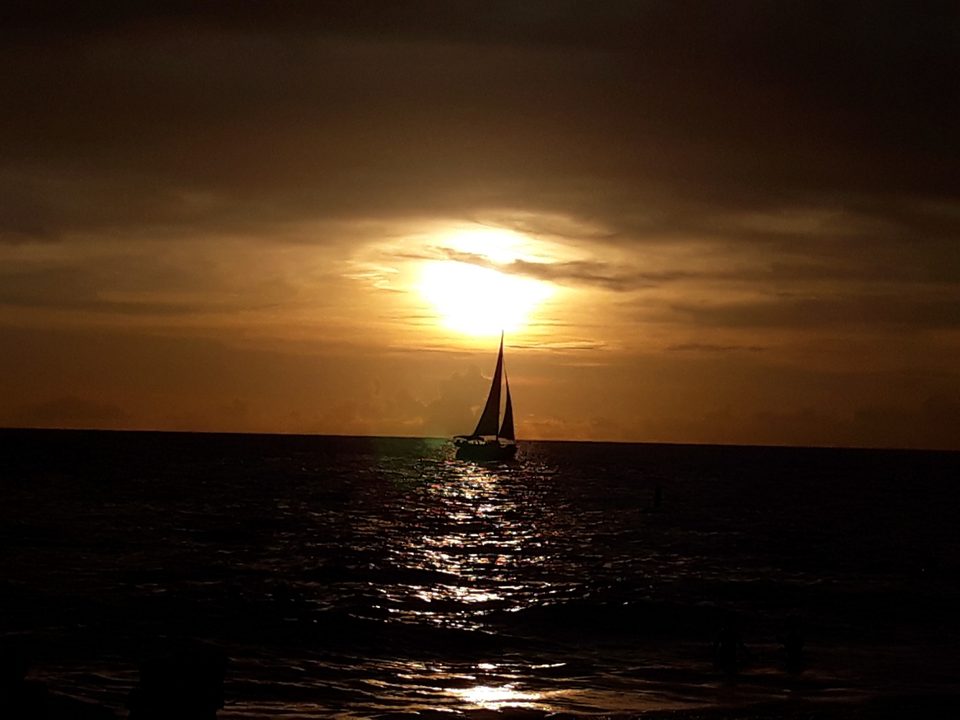 Sailboat silhouette on the Gulf at sunset near Venice, Florida
